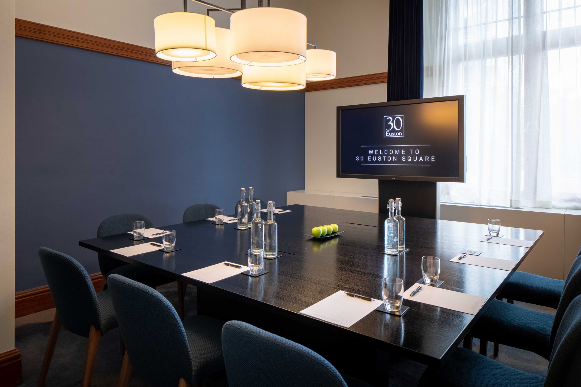 30 euston square conference room with navy wall and seats
