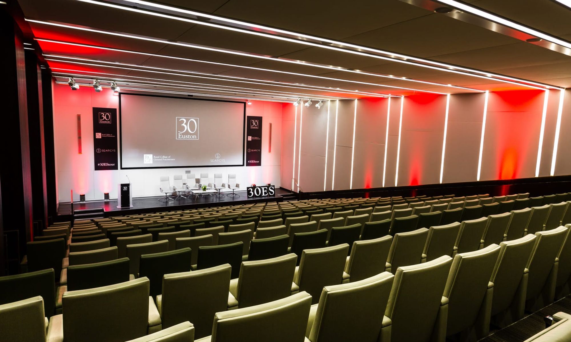 The Auditorium at 30 Euston Square empty room with red and white striped lighting